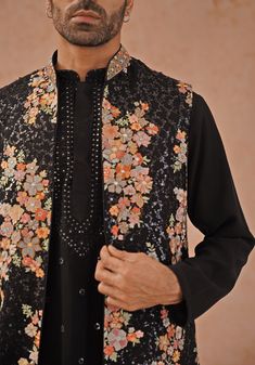 Make a lasting impression with Black Jacket Kurta. Crafted from georgette, the jacket features resham and sequinned embroidery. The yoke design kurta boasts all-over motifs, two pockets, and pure lining. Completed with an embroidered dupatta and patiyala pant. Perfect for Cocktail parties. Composition : Jacket, Kurta, Patiyala pant & Dupatta : Viscose Georgette Care: Dry Clean Only and Vacuum Storage This product can be customized for sleeves, length and colour Delivery : 2-4 weeks as the produc Festive Nehru Jacket With Chikankari Embroidery For Fall, Traditional Spring Kurta With Sequins, Traditional Embellished Spring Outerwear, Festive Embellished Outerwear For Festivals, Traditional Festive Outerwear With Sequins, Traditional Sequined Outerwear For Festive Season, Black Embroidered Nehru Jacket For Festivals, Traditional Festive Sequined Outerwear, Festive Long Sleeve Nehru Jacket With Sequins