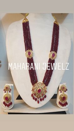 Beautiful ruby necklace with matching earrings, set in gold plated silver. Comes in natural or faux rubies . The photograph is of faux rubies. Necklace length: adjustable from 24-30 inches Earrings: approximately 2 inches Indian Bridal Necklace, Indian Choker Necklace, Indian Wedding Jewelry Sets, Necklace Set With Earrings, Antique Gold Jewelry Indian, Beaded Necklace Designs, Colour Stone, Bridal Necklace Set, Gold Jewelry Stores