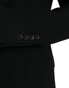 The Dolce & Gabbana Black Blazer With Crown Bee Patch features a sleek, slim fit design with a single-breasted closure and one button. Made in Italy, this blazer is crafted from high-quality 100% virgin wool and lined with a luxurious blend of 58% viscose, 27% acetate, and 15% cupro. It also includes inside pockets and an open vent in the back for added style and functionality. Single Breasted Blazer, Black Crown, Style Blazer, Single Breasted Coat, Breasted Blazer, Guess Jeans, Premium Brands, Black Blazer, Seychelles