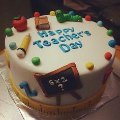 there is a cake that says happy teacher's day on the top of it