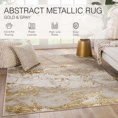 an abstract metallic rug with gold and gray colors on the floor in a living room