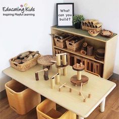 a wooden table topped with lots of toys