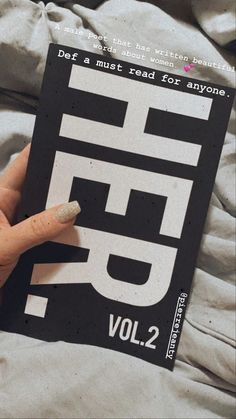 a person holding up a book with the word f9 on it's cover