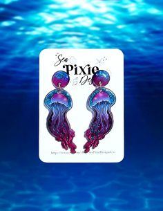 Hey there, beach lovers! Dive into summer vibes with our Glittery Jellyfish Shrink Plastic Resin Earrings. Handmade with love, these coastal earrings embody the essence of the ocean. Not only are they stylish, but they are also lightweight and nickel-free, ensuring comfortable wear for hours. Whether you're strolling along the beach or simply dreaming of the sea, these earrings will add a touch of coastal charm to any outfit. Embrace your love for the ocean and add a splash of nautical beauty to Unicorn Floaties, Coastal Earrings, Unicorn Pool Float, Tropical Jewelry, Orange Glitter, Plastic Earrings, Shrink Plastic, Manta Ray, Plastic Resin