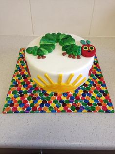 the very hungry caterpillar cake is ready to be eaten