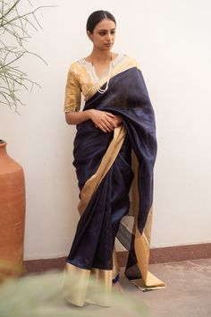 Navy blue silk chanderi saree with gold contrast border.
Components: 1
Type Of Work: Plain
Fabric: Silk Banarasi
Color: Blue
Other Details: 
Note: Stitched blouse worn by the model is not for sale
Disclaimer: The joint fabric pieces may vary. Designers unique process ensures that the placement of fabric will always be similar but not same. They always create the product with stretch fabrics of similar types and weights that fit within the same color palette and design. The piece will resemble th Chanderi Saree, Types Of Work, Plain Fabric, Blouse For Women, Fashion App, Fabric Silk, Blouse Online, Blue Silk, Aza Fashion