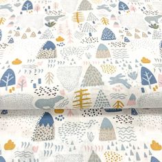 an image of a fabric with trees and mountains on it in blue, pink, yellow and white