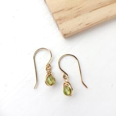 Peridot Dangle Earrings, 14K Gold Filled, Rose Gold Filled, Sterling Silver, August Birthstone Green Peridot Earrings https://etsy.me/2pFc4gK #jewellery #earrings #birthday #minimalist #peridot Gold Peridot Gemstone Earrings, Dainty Earrings For Jewelry Making With May Birthstone, Yellow Gold Peridot Earrings For Gift, Peridot Dangle Earrings Gift, Gold Peridot Earrings For May Birthstone, Nickel-free Yellow Gold Briolette Earrings, Nickel-free Briolette Yellow Gold Earrings, Delicate Wire Wrapped Yellow Gold Earrings, Delicate Yellow Gold Wire Wrapped Earrings