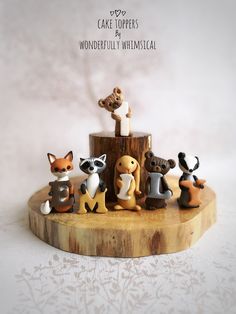 small figurines are sitting on a wooden stand