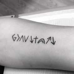 a person with a tattoo on their arm that says gnvtata in cursive writing