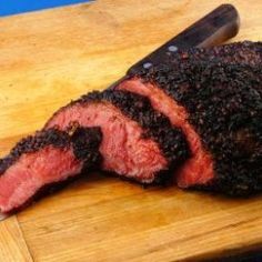 a piece of meat that is on top of a cutting board