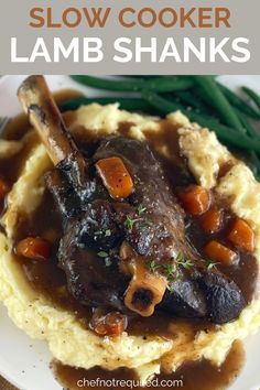 Lamb shank sitting on mashed potato on a white plate with green beans and a fork. Slow Cooker Lamb Shanks Crockpot, Crock Pot Lamb Shanks, Slow Cooked Lamb Shanks Slow Cooker, Crockpot Lamb Shanks, Lamb Shank Recipes, Crockpot Lamb Recipes, Lamb Shank Recipe Slow Cooker, Persian Lamb Shank Recipe, Lamb Recipes Crockpot