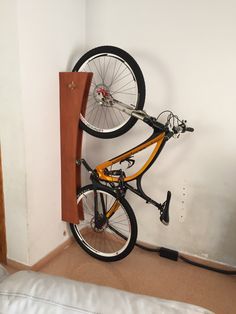 there is a bike hanging on the wall