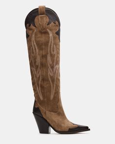 Elevate your look with the IGNITE Western boot. These knee-high boots feature a pointed toe for a sleek and sophisticated touch. These boots are perfect for any occasion and add a touch of Western charm to your wardrobe. 3.75 inch heel height 15.75 inch shaft circumference 14.75 inch shaft height Suede upper material Synthetic lining Leather sock Synthetic sole Fit tip: If you are in between sizes, size up a half-size Imported Summer Era, Womens Fall Boots, Snakeskin Cowboy Boots, Cowgirl Summer, Fall Boots, Leather Socks, Western Boot, Shoe Fits, Boots Fall