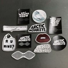 various stickers on the back of a refrigerator door that say arctic monkeys, arctic monkeys and arctic monkeys