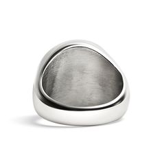 a silver ring on a white background