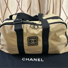 Authentic Chanel Xl Boston Bag, Sport Line Collection, Black And Beige Nylon Fabric, Zipper Out Side, Zipper Closure, No Rips Or Tears, Need To Be Clean,Good Condition.Come With Dust Bag Be Clean, Black And Beige, Chanel Bags, Boston Bag, Nylon Fabric, Travel Bags, Side Zipper, Boston, Dust Bag