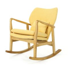 a wooden rocking chair with yellow cushions on it's back legs and armrests