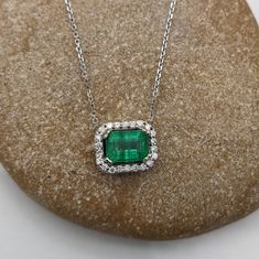 This beautiful pendant necklace features a 0.84 carat emerald cut Emerald gemstone with a halo of natural earth mined diamonds set in solid 14K gold. This Emerald pendant necklace makes a lovely May birthstone gift for your loved ones! This necklace is made with solid 14k Gold and natural Earth mined SI / G-H diamonds. Emerald Pendant Necklace, Emerald Necklace Pendant, Beautiful Pendant Necklace, Jewelry Appraisal, Emerald Pendant, May Birthstone, Birthstone Gifts, Emerald Gemstone, Custom Jewelry Design