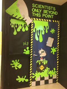 a door decorated with green and black paint