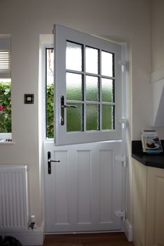 a white door and window in a room