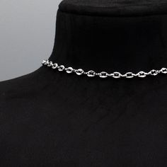 Coffee Bean Chain (Also known as the Mariner Link) A stunning minimalist stainless steel choker. 5mm x 6mm Width Stainless Coffee Bean Chain 4 Inch 4.7mm Stainless Steel Adjuster Chain Hand Made in the UK Sizing: Small 11 - 15 Inches (28cm - 38cm) Medium 13 - 17 Inches (33cm - 43cm) Large 15 - 19 Inches (38cm - 48.5cm) Stainless Steel Clavicle Chain Choker Gift, Elegant Silver Link Choker, Silver Stainless Steel Choker With Clavicle Chain, Silver Stainless Steel Choker Necklace, Minimalist Silver Choker With Lobster Clasp, Gift Stainless Steel Choker Chain Necklace, Stainless Steel Choker Chain Necklace As Gift, Stainless Steel Choker Chain Necklace Gift, Stainless Steel Choker Chain Necklace For Gift