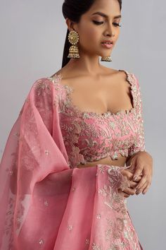 Rose pink organza lehenga with cutdana work, floral jaal motifs and cutwork hem. Comes with embellished blouse and dupatta.
Components:3
Embroidered
Neckline:Square
Sleeve Length:Half
Fabric:Organza
Color:Pink

Tie-up cutout back
Kamar tassels
Cutwork detail
Note: Cancan worn by the model is not for sale - Aza Fashions Pink Blouse Piece With Zari Work For Reception, Pink Tissue Silk Choli With Resham Embroidery, Festive Pink Blouse Piece For Reception, Pink Sheer Dupatta Traditional Wear In Organza, Pink Unstitched Blouse Piece For Reception, Unstitched Pink Blouse Piece For Reception, Pink Anarkali Blouse Piece For Reception, Pink Traditional Wear With Unstitched Blouse For Reception, Pink Anarkali Pre-draped Saree With Intricate Embroidery