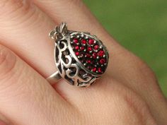 Garnet Stone Sterling Silver Pomegranate Fruit Persephone Ring Jewelry, Armenian Jewelry The ring made of 925 sterling silver. The set consists of a ring, earrings and a pendant. The set is made in the form of cut garnets with red zircons instead of garnet seeds. The back of the fruit is openwork. The jewelry is lightweight and very comfortable. You can order these rhodium-plated or gold-plated earrings at a surcharge. For additional options please contact me. The Ring: Size - 20*25 mm. ring siz Sterling Silver Rings With Jewels For Gifts, Valentine's Day Metal Ring Jewelry, Stamped 925 Silver Ring For Valentine's Day, Armenian Jewelry, Pomegranate Earrings, Star Garnet, Garnet Gem, Red Band, Garnet Stone