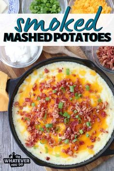 baked mashed potatoes in a cast iron skillet with bacon, cheese and green onions