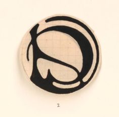 a black and white circle with the letter s on it