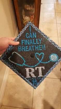 someone is holding up a graduation cap that says, i can finally breathe the rtt