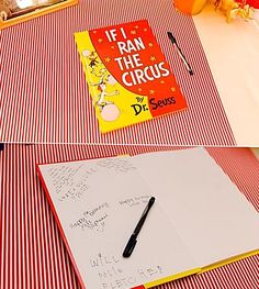 a book sitting on top of a table next to a pen and paper with writing on it