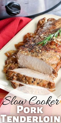 pork tenderloin on a white plate with rosemary garnish and text slow cooker pork tenderloin