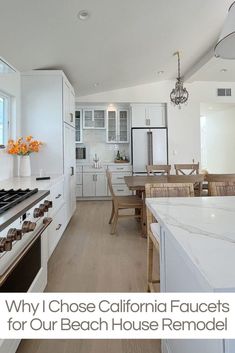 a kitchen with white cabinets and an island in the middle is seen from across the room