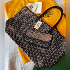 Goyard St. Louis Tote Bag Pm Comes With Pouch, Certificate Of Authenticity, Tag, Goyard Paper Bag Color: Black 10.5" H X 5.5" W 13.5" Goyardine Canvas & Chevroches Calfskin Linen And Cotton Inner Side Palladium Height Of Handle : Approx 7" Made In France All Photos And Video Reflects This Bag In Perfect And Almost Brand New Condition (Except For Tiny, Barely Noticeable Stain In Interior). Otherwise Excellent And No Other Flaws. **No Transactions Outside Poshmark Will Be Welcomed ** Black Monogram Canvas Pouch Shoulder Bag, Black Monogram Canvas Pouch Bag, Goyard St Louis Tote, Goyard Saint Louis Pm, Goyard Saint Louis, Goyard Bag, Saint Louis, Womens Tote Bags, St Louis