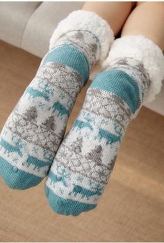 Walking in the Winter Wonderland or even just on your cold floors in the winter; these knitted slipper socks will keep your feet nice and cozy on those cold winter days and nights. Featuring a with faux fur lining and a rubber sole design on the bottom to prevent slipping when walking these are sure to be a new favorite part of your lounge wear. Made with a polyester and cotton blend. Comes in 21 fun patterns from which to choose. Warm Comfortable Socks, Soft Indoor Socks For Winter, Casual Indoor Socks For Winter, Comfortable Knitted Winter Socks, Comfortable Winter Slippers For Home, Cozy Round Toe Winter Socks, Cozy Comfortable Winter Socks, Snug Non-slip Winter Socks, White Cozy Slippers For Home