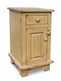 an old wooden cabinet with two doors and knobs on the bottom drawer, against a white background