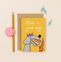 a greeting card with a cartoon dog holding a piece of cake on top of it