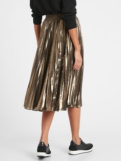 METALLIC: A special foil application adds sophisticated shine to this soft chiffon fabric.  A-LINE: This flowy skirt has a flattering, A-line fit.  Elastic waistband.  Pull-on design.  Lined to the knee.  High waisted.  Fitted through the waist and h Elegant Knee-length Pleated Skirt For Party, Chic Metallic Flowy Skirt, Chic Flowy Metallic Skirt, Elegant A-line Party Bottoms, Metallic Pleated Bottoms For Party, Metallic Flared Skirt For Night Out, Glamorous Spring Pleated Skirt, Chic Gold Flared Skirt, Elegant Holiday Cocktail Bottoms