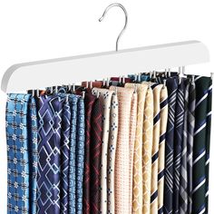 a rack with ties hanging from it's hooks on a white hanger,