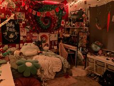 a bedroom decorated for christmas with decorations on the wall and lights hanging from the ceiling