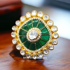 About Product:- Product Code:- SC-SPR-1396 Product Type:- Ring Product Location:- Jaipur, India Product Weight :- 13.500 Grams Product Material :- 925 Sterling Silver Gemstone Used :- Moissanite ( Lab Made ) , Emerald ( Lab Made ) Gemstone Color :- White, Green Ring Size :- 7 US (can be customized) Finish :-  Gold Plating Over Silver Material Type :- Skin Friendly ( Lead and Nickel Free) Shipping :- We offer free Standard shipping. We assure for 15-20 days delivery in most of the parts of the gl Vintage Gold Ring, Antique Gold Rings, Gold Ring For Women, Indian Rings, Emerald Band, Vintage Gold Rings, Statement Rings Diamond, Green Ring, Green Rings