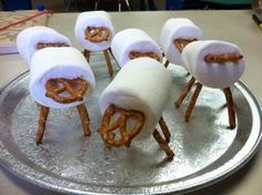 some pretzels are wrapped in marshmallows and have been made to look like pretzels