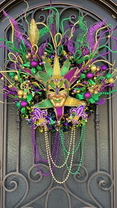 a mardi gras mask hanging on the front door