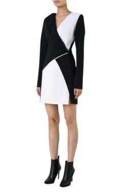 Super-sharp bodycon dresses are Mugler's speciality, and this black and white bonded-crepe design is a slick proposition.Bold monochrome splices are carefully placed to contour the figure, while long sleeves temper the impact of the thigh-high hemlineBlack, bonded-crepe V-neckLong sleevesMini lengthRight side of neckline, angular fold-over feature, white crepe backingFront chest and skirt white angular-panelsSmall front skirt-slitCentre-back top hook and zip-fastening53% acetate, 47% viscoseFits Mini Dress Runway, Chevron Outfit, Mini Dresses Online, Luxury Women Fashion, Long Sleeve Mini, Crepe Dress, White Skirts, Long Sleeve Mini Dress, Black Fabric