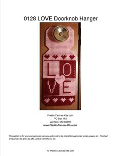 a pink door hanger with the word love on it