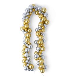 a gold and silver beaded necklace on a white background