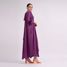 Maxi dress with long sleeves, wide cuffs and 'V' neckline and scarves which can be tied on the back of the neck, made in metallic fabric. Dry clean only. Fall Party Abaya With Long Sleeves, Long Sleeve Purple Party Kaftan, Elegant Dresses With Draped Sleeves For Eid, Spring Evening Long Sleeve Abaya, Chic Long Sleeve Abaya For Spring, Chic Spring Long Sleeve Abaya, Dress With Draped Sleeves For Party And Eid, Chic Long Sleeve Spring Abaya, Party Dresses With Draped Sleeves For Eid