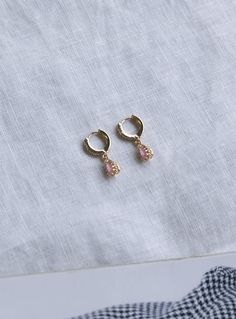 Dainty earrings Princess Polly exclusive One pair Mini hoops Pink drop charm Faux diamante detailing Latch fastening Gold toned hardware High shine finish Length: 2cm / 0.78” 60% brass, 40% zircon Queen Earrings, Original Necklace, Ice Queen, Gold Sunglasses, Dainty Earrings, Online Earrings, Princess Polly, Hair Tools, Accessories Earrings