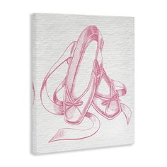 a pair of ballet shoes wrapped in pink ribbon on a white background canvas wall art print